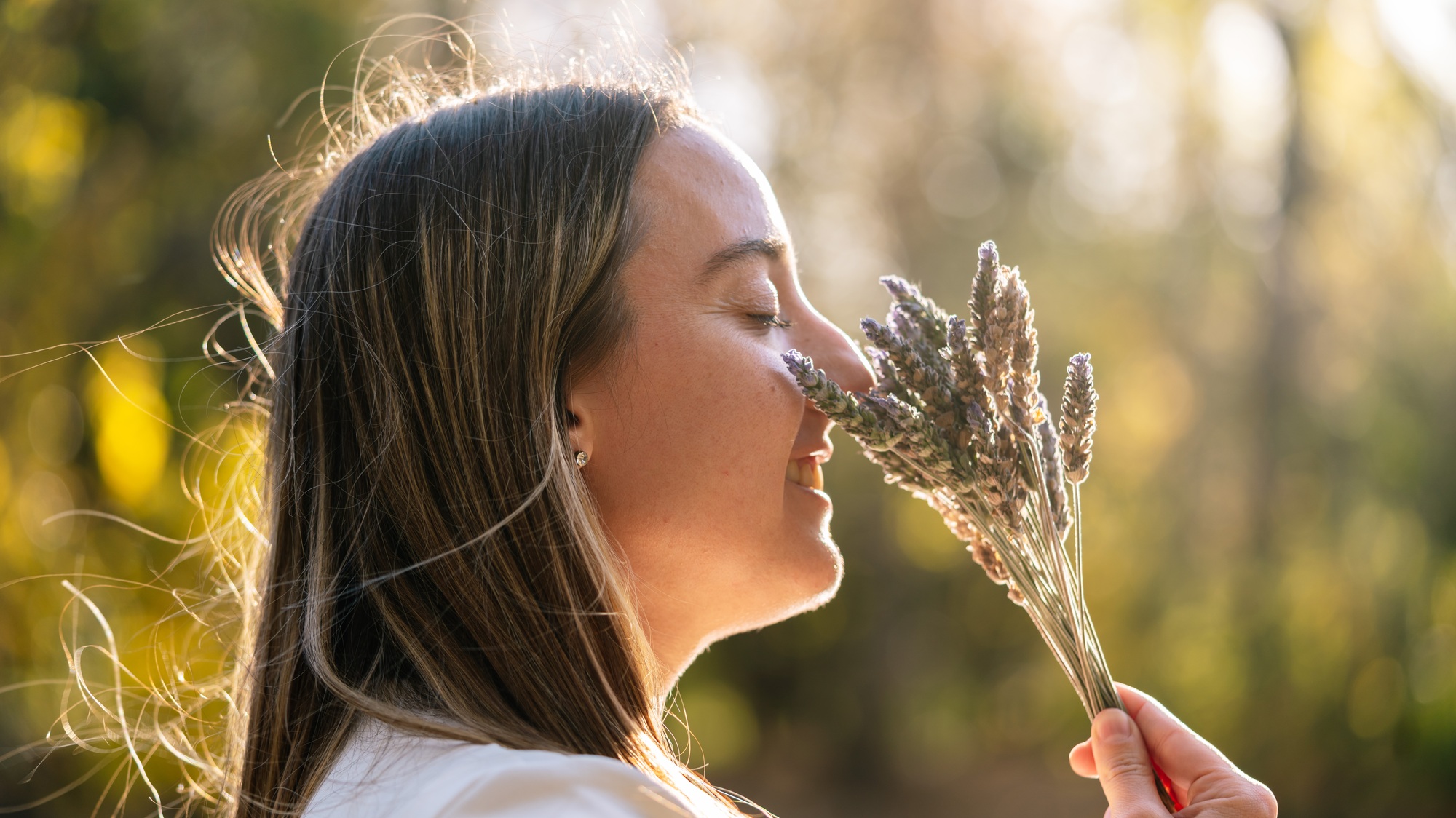 woman smelling lavander for a spiritual ritual